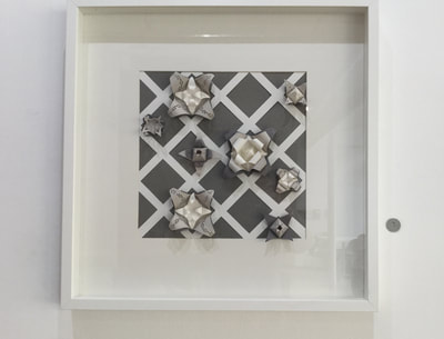 Large "Pyramid" wall piece in shades of grey, black and white.